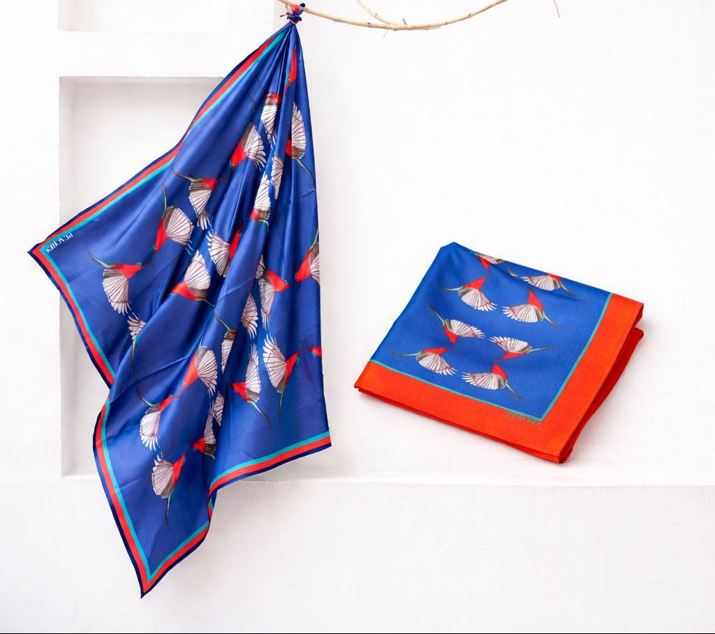 Blue and red patterned scarf with Blue red pocket square in a white background
